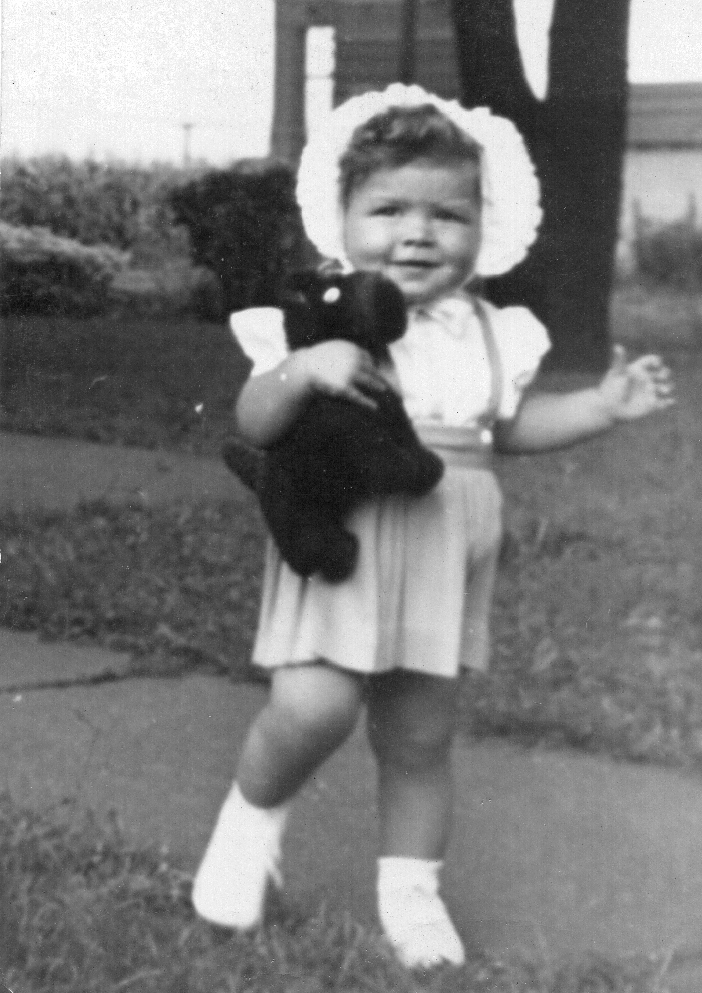 A child holding a stuffed animal
